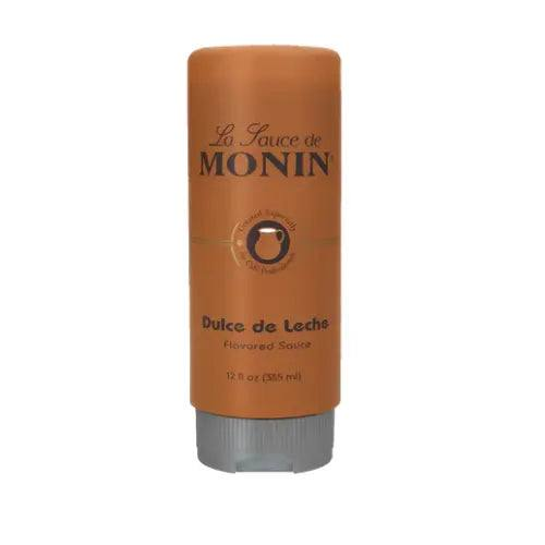 Bottle of Monin Sauce Dulce de Leche 355 ml with creamy caramel sauce for desserts and drinks