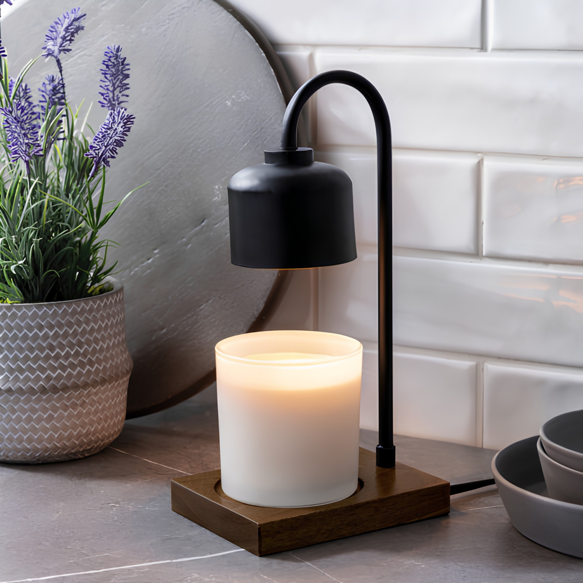 Black arched candle warmer lamp and wood